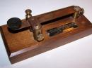 Antique strap key made at the University of Michigan.